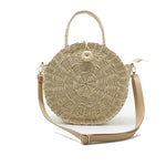 Beige straw bag with leather strap