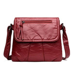 Red leather flap bag with triple compartment