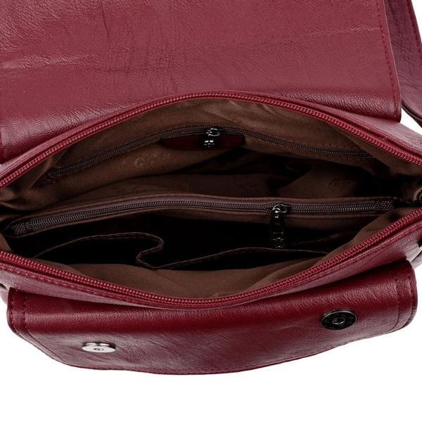 red leather handbag with pocket in the middle