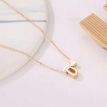 d letter necklace with hearth