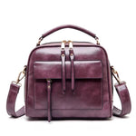 Pink leather crossbody bags with multiple compartments