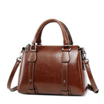 Dark brown leather crossbody purse with handles