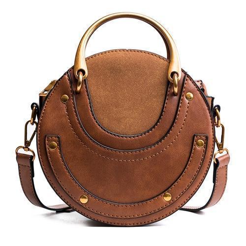 Brown round crossbody bag with metal handles
