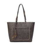 Gray leather tote bag with tassels