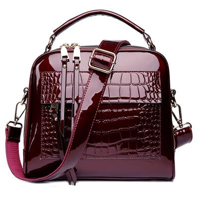 Red shiny leather crossbody bags with two zipper compartments