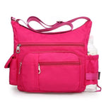 Hot pink crossbody bag with water bottle holder